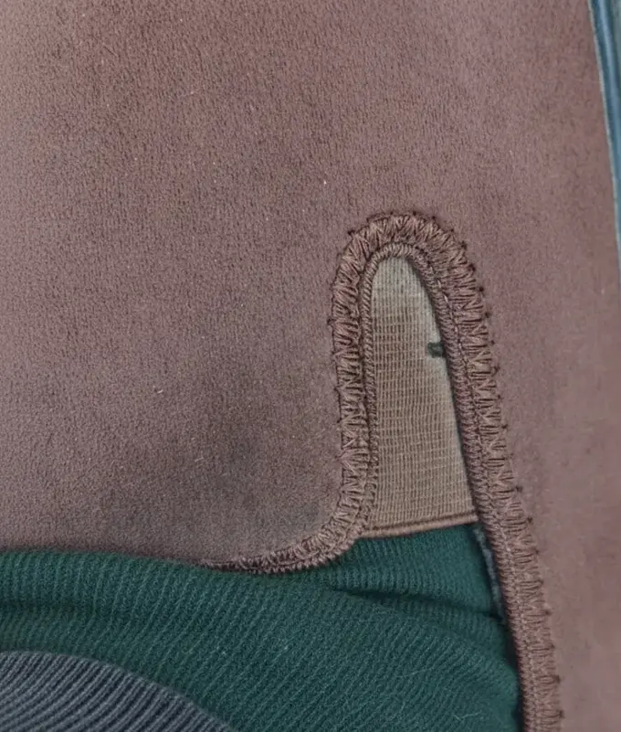 Close-up of stitching and an elastic panel on a Freet Mooch upper