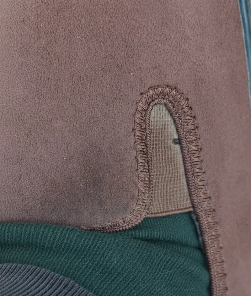 Close-up of stitching and an elastic panel on a Freet Mooch upper