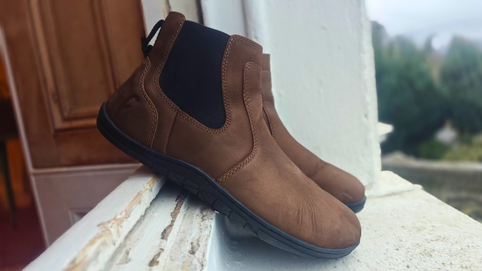 Freet Durham barefoot Chelsea boot side profile on a window ledge showing stitched sole construction