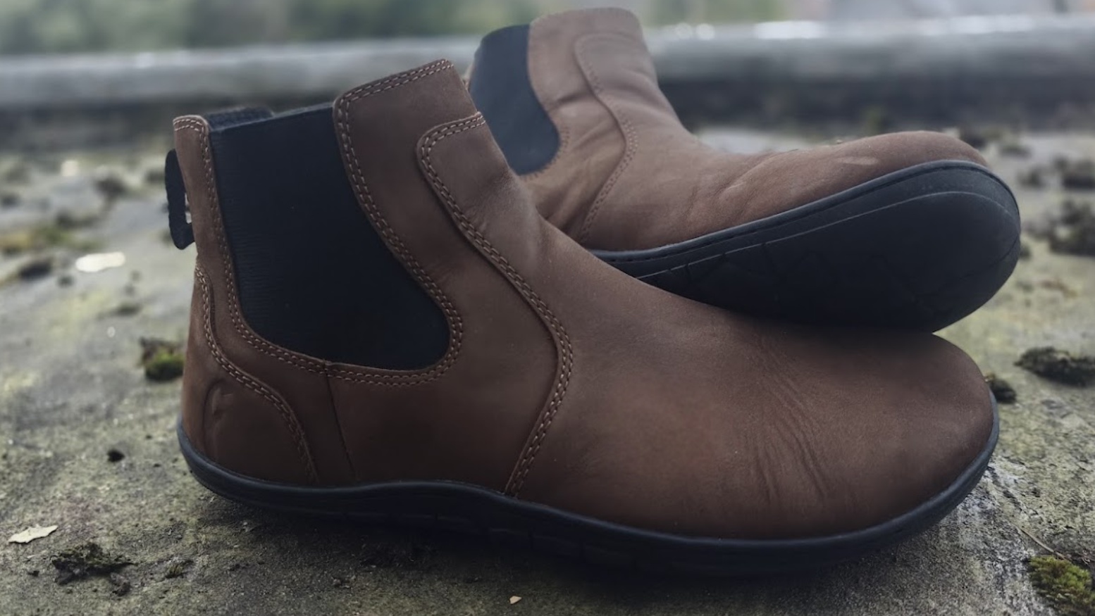 Freet Durham boot propped showing UrbanGrip sole pattern on mossy ground