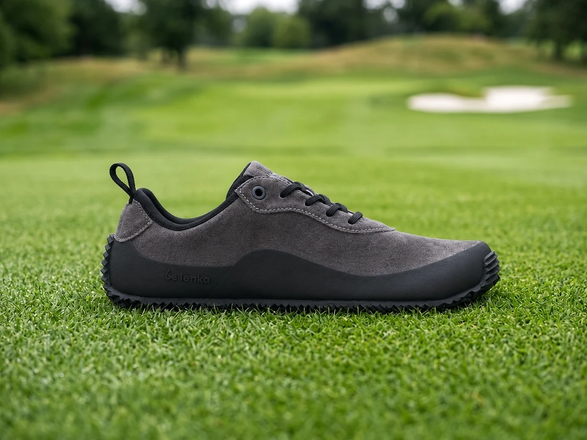 Be Lenka Trailwalker 3 barefoot golf shoe side profile on green fairway turf showing zero-drop flat sole
