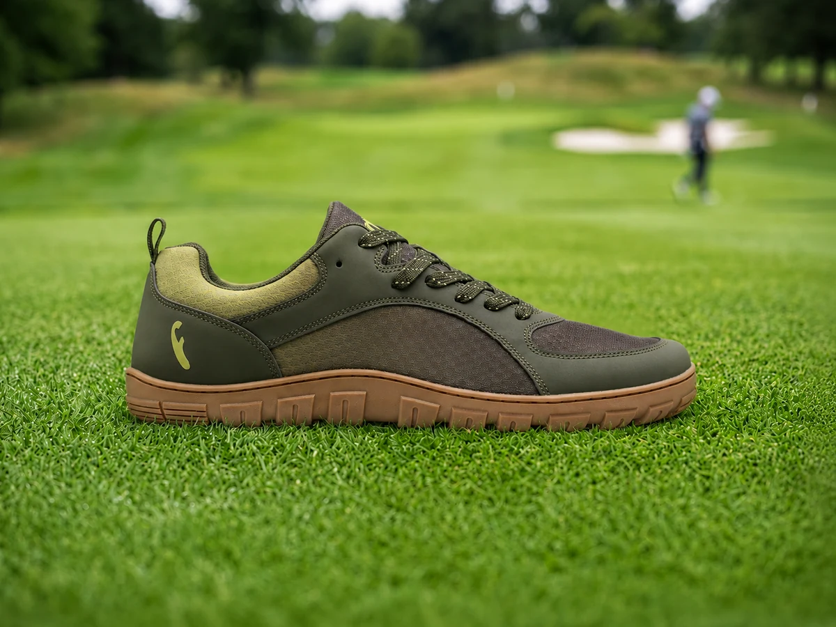 Freet Feldom 3 barefoot golf shoe side profile on green fairway turf showing zero-drop flat sole
