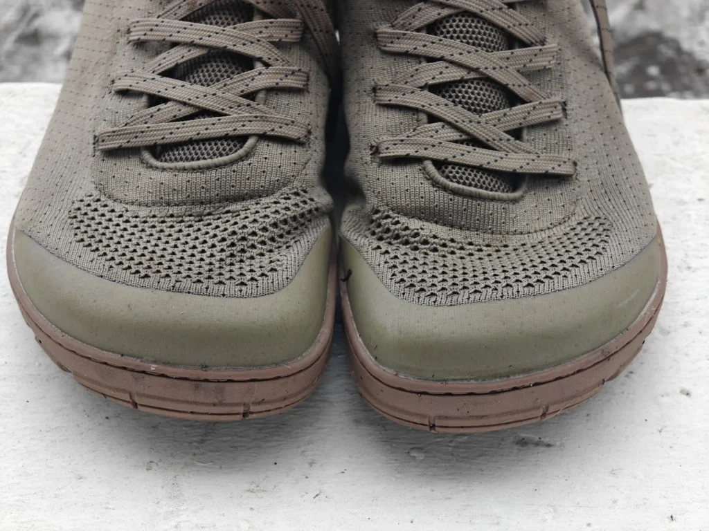 Front-on view of both Freet Danum boots, showing the rubber toe bumpers and knitted uppers.