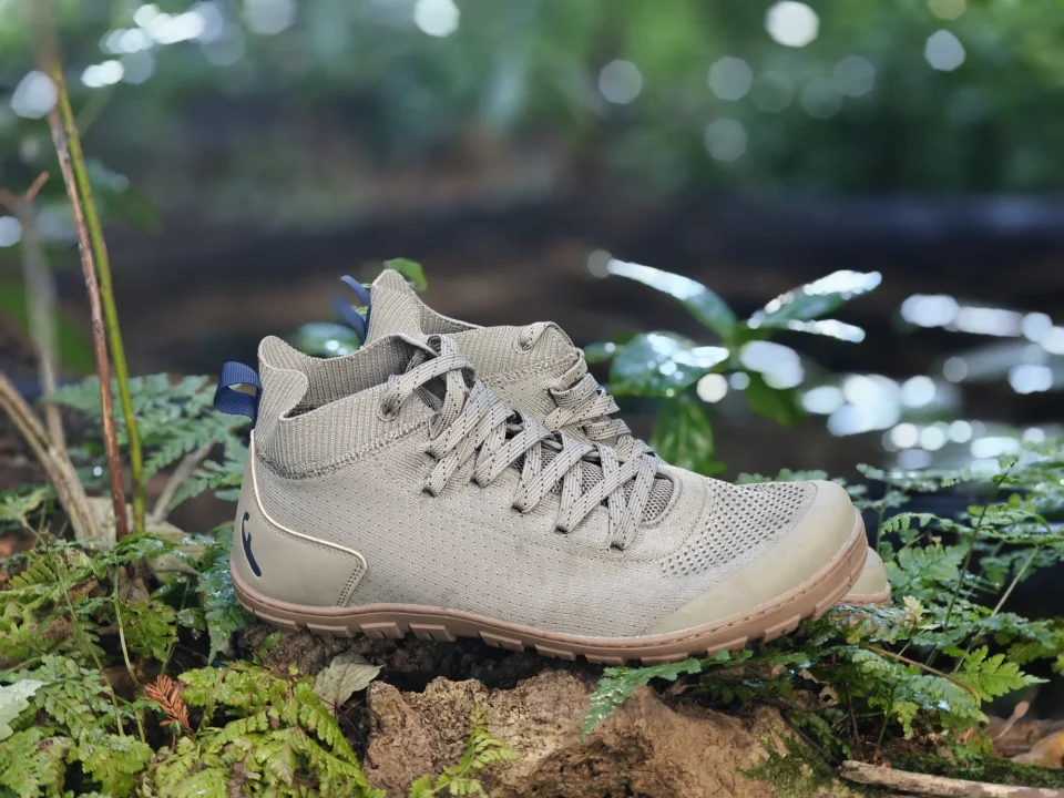 Freet Danum shoes resting on moss beside a woodland river.