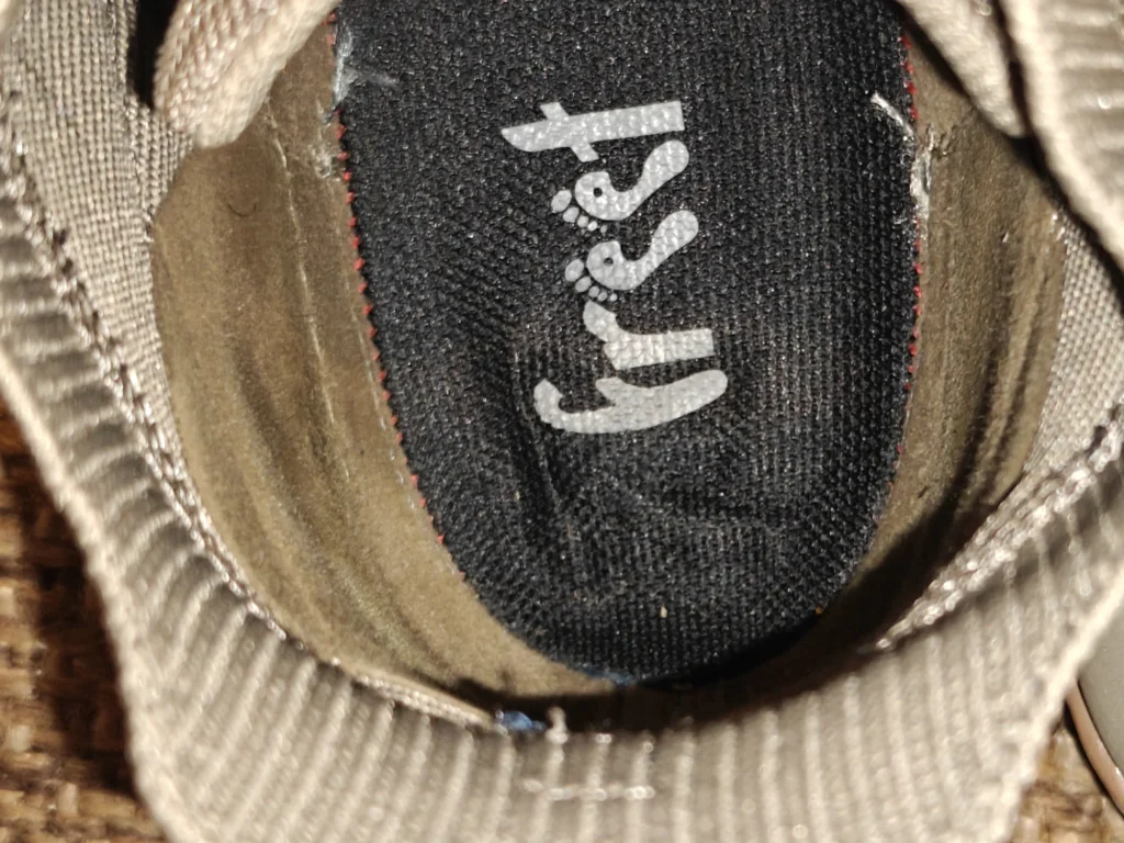 Top-down interior view of the Freet Danum footbed and heel lining through the knit collar.