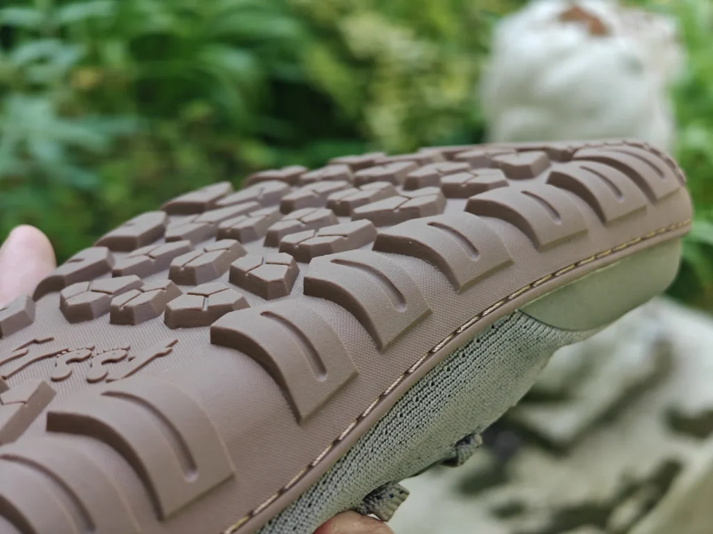 Close-up macro of the Freet Danum HillGrip outsole lugs and sidewall stitching.
