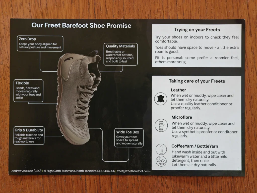 Freet Barefoot Shoe Promise card explaining zero drop, wide toe box, and BottleYarn care instructions on a wooden table.