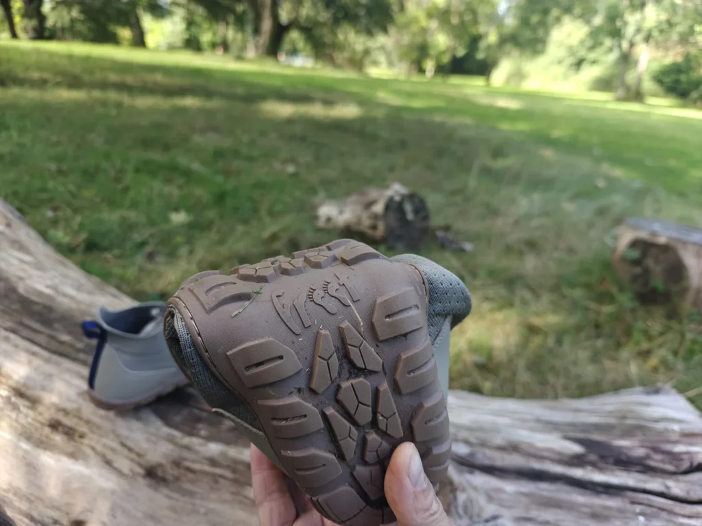 Hand bending the Freet Danum sole in half, showing the sole flexing along moulded grooves.