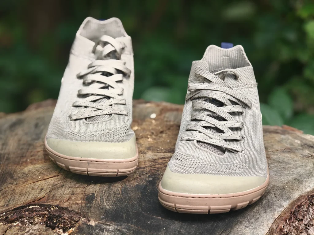 Front view of both Freet Danum shoes side by side on a tree stump, showing the wide forefoot shape.